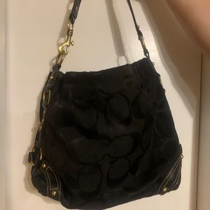Black with gold hardware Coach purse small tote. Scratch on leather of handle